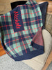Knitted in Navy, Sage and Red, this striking Tartan blanket can be personalised with babies name.