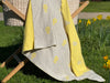 The cutest flower you ever did see. Our Fine Knit sunflower design will bring a smile to baby and toddler alike. Knitted in our studio on The Mornington Peninsula, Victoria, Australia, this blanky will become a security favourite. Pure and soft knitted from Organic Cotton, with a choice of on trand fashion colours. This is Oatmeal and Lemon