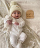At The Knit Studio we knit our personalised baby blankets in 100% Organic Cotton. Remi’s Cot sized blanket Oatmeal and White. There are 25 colours and 7 fonts plus over 50 graphic symbols to choose from. Sustainably, each blanket is individually knitted to order. This custom blanket is personalized with the name of your choice. Australian Made and owned, we provide free shipping worldwide. Design your own named blanket. Perfect for baby’s birthday or baby-shower and toddler bed.