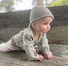 Baby wearing Little Love Beanie and Fine Knit Cardigan. A super sweet gift combo.