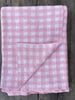 The Knit Studio, Classic Gingham blanket is a timeless baby gift. Quality that lasts and is guaranteed. Choose colours from our stunning range. Knitted on the Mornington Peninsula, Victoria, Australia. Family owned. Pale Pink and White. Pure organic cotton that is certified. Dyed and spun in Italy by Filmar.