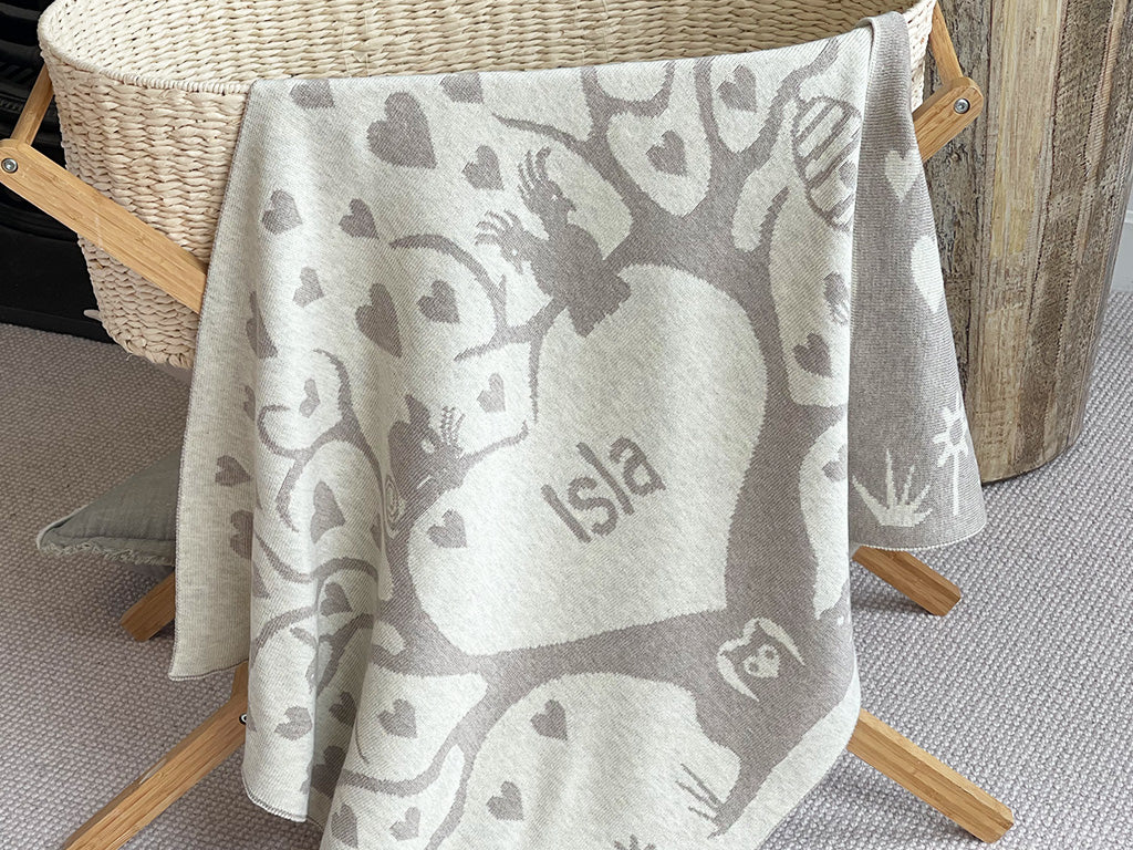 The Knit Studio personalised baby blankets are knitted in the finest quality Organic Cotton. This Love Tree Cot sized blanket is Designed by us from our Designer Collection. Soft and luxurious, the perfect keepsake. Choose from our preselected colour combos. Sustainably, each blanket is individually knitted to order. This custom blanket is personalized with the name of your choice. Australian Made and owned, we provide free shipping worldwide. Great for couch cuddles too. Choice of size. 