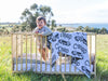 At The Knit Studio we knit our personalised baby blankets in 100% Organic Cotton. This Cot sized blanket is Tangerine and White, the perfect keepsake. There are 25 colours and 7 fonts plus over 50 graphic symbols to choose from. Sustainably, each blanket is individually knitted to order. This custom blanket is personalized with the name of your choice. Australian Made and owned, we provide free shipping worldwide. Design your own named blanket. Perfect for baby’s birthday or Car seat, Pram and toddler bed.