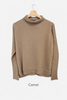 Merino wool jumper in camel caramel colour with funnel rolled neckline