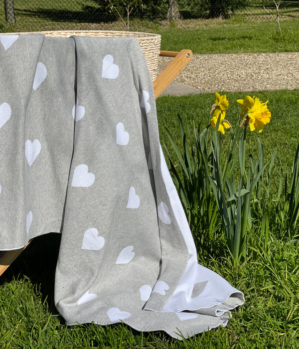 The Knit Studio. Fine knit Love Heart blanket. Choose from a selection of colours. This soft pure organic cotton cot sized blanket is perfect for pram and bassinet to. Knitted in our studio on the Mornington Peninsula in Australia. Quality guaranteed. Pale Grey and White.