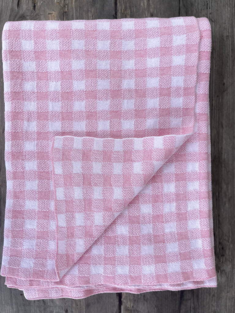 The Knit Studio, Classic Gingham blanket is a timeless baby gift. Quality that lasts and is guaranteed. Choose colours from our stunning range. Knitted on the Mornington Peninsula, Victoria, Australia. Family owned. Pale Pink and White. Pure organic cotton that is certified. Dyed and spun in Italy by Filmar.
