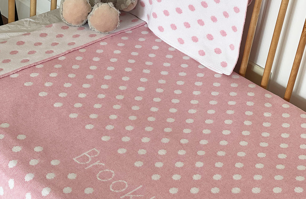 The Knit Studio personalised baby blankets are knitted in the finest quality Organic Cotton. This Spotty or Polka Dot Cot sized blanket is Designed by us from our Designer Collection. Soft and luxurious, the perfect keepsake. Choose from our preselected colour combos. Sustainably, each blanket is individually knitted to order. This custom blanket is personalized with the name of your choice. Australian Made and owned, we provide free shipping worldwide. Great for couch cuddles too. Choice of size. 